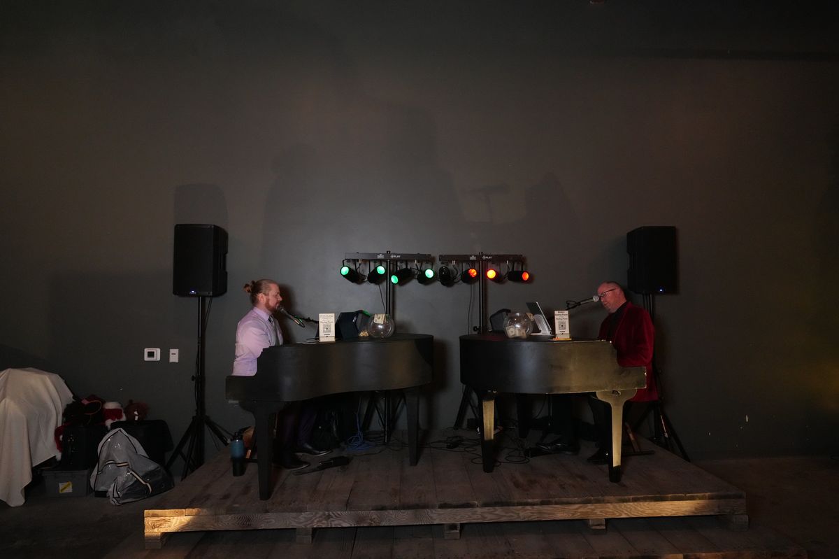 Dueling pianos performance with a full crowd